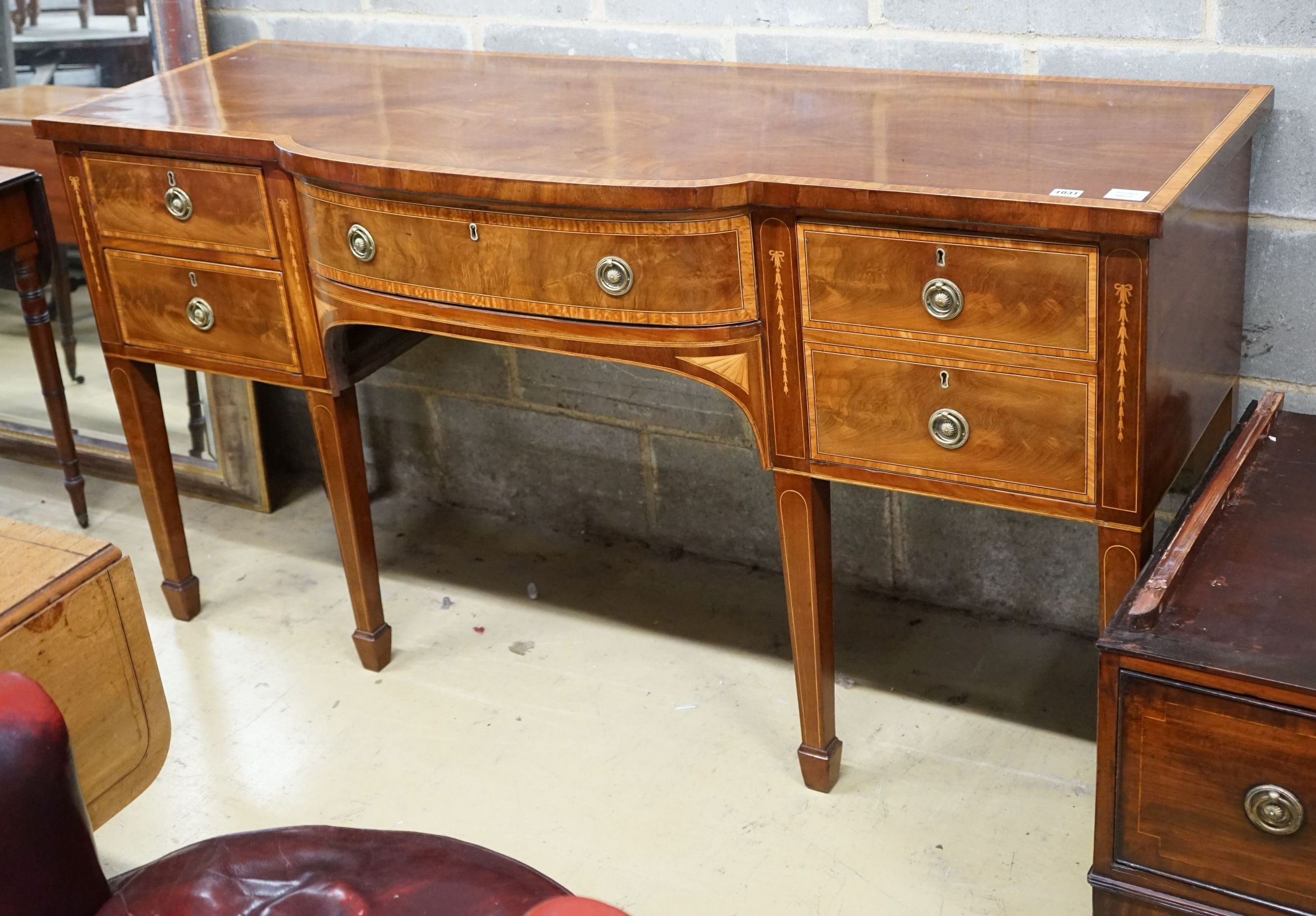 A George III satinwood banded mahogany bow front sideboard, length 167cm, depth 58cm, height 88cm